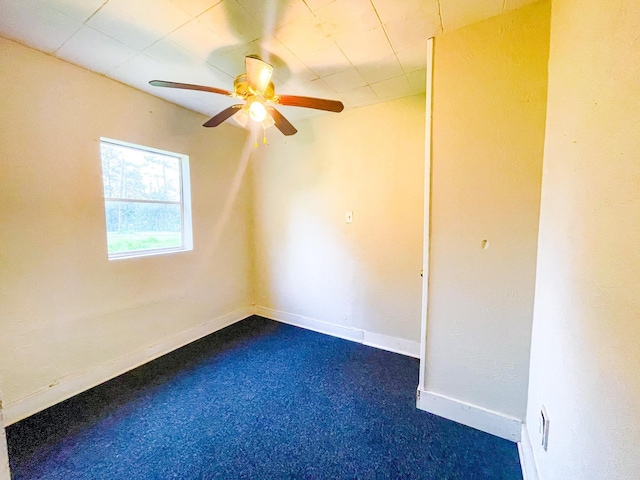 carpeted empty room with ceiling fan