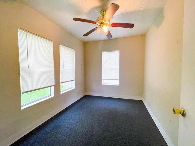 spare room with carpet flooring and ceiling fan