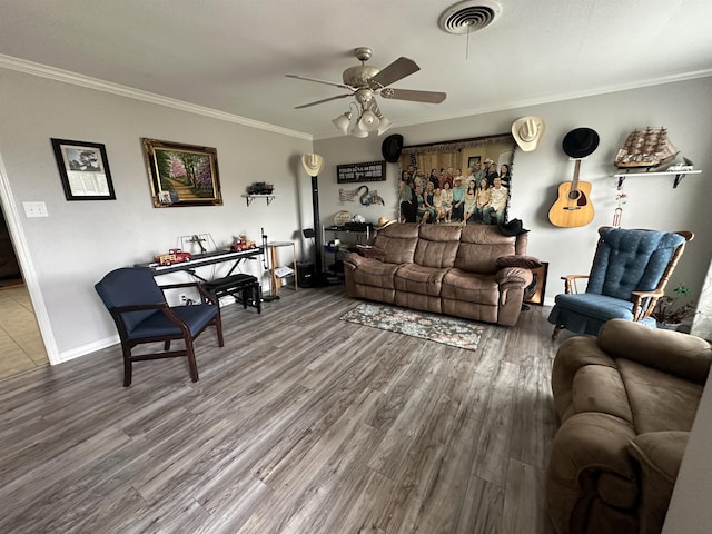 living room featuring crown molding, wood-type flooring, and ceiling fan