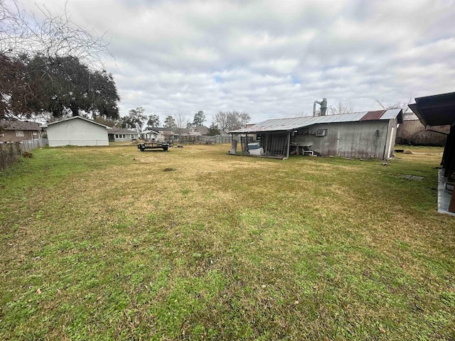 view of yard with an outbuilding