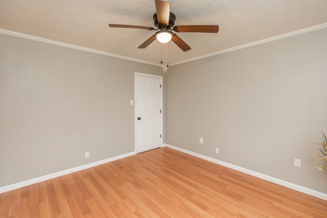 empty room with baseboards, ceiling fan, a textured ceiling, crown molding, and light wood-style floors