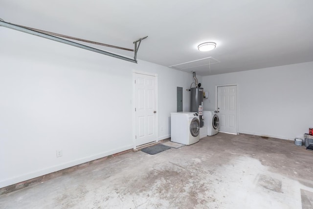 garage with gas water heater, electric panel, baseboards, and separate washer and dryer