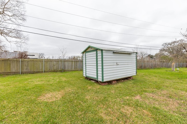 view of shed featuring a fenced backyard