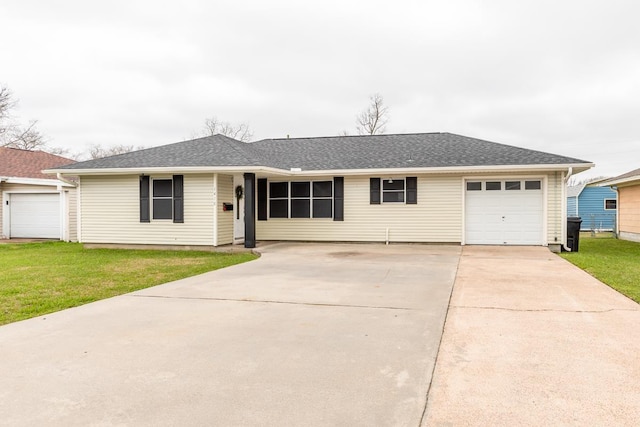 ranch-style home with a garage, roof with shingles, driveway, and a front lawn