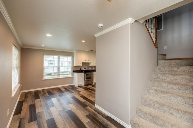 3075 Shivers St, Vidor, TX 77662 - stairs featuring ornamental molding, wood finished floors, baseboards, and recessed lighting