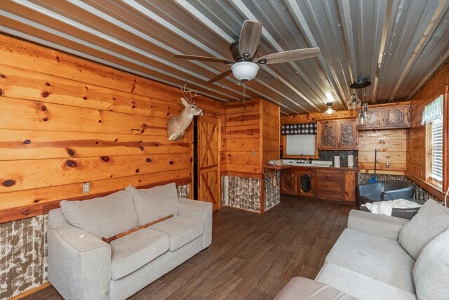 3075 Shivers St, Vidor, TX 77662 - living area with wood walls, dark wood-style flooring, ceiling fan, and wooden ceiling