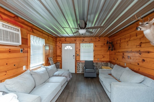 3075 Shivers St, Vidor, TX 77662 - living room with plenty of natural light, a wall mounted air conditioner, wooden walls, a ceiling fan, and dark wood-style floors