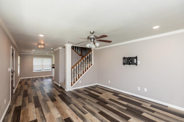 3075 Shivers St, Vidor, TX 77662 - spare room featuring wood finished floors, baseboards, a ceiling fan, stairway, and crown molding