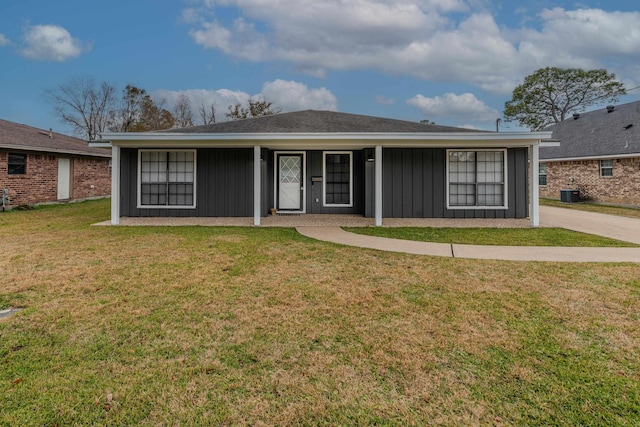 single story home with central AC and a front yard