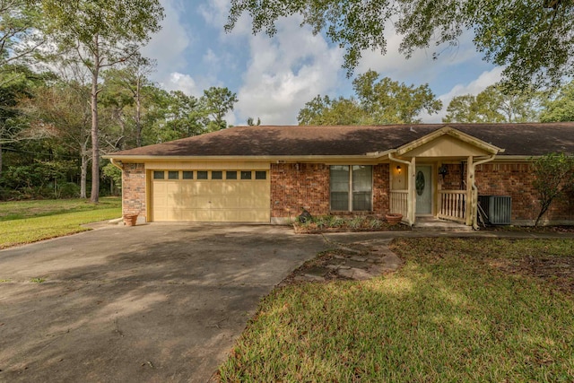 ranch-style home with a front yard and a garage