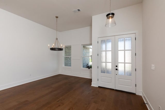 3570 Lily Ln, Beaumont, TX 77713 - entrance foyer featuring a chandelier, dark wood-style floors, french doors, and baseboards