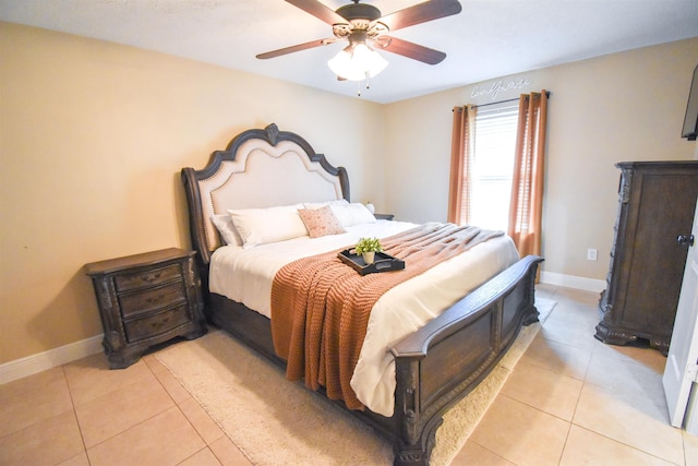 bedroom featuring light tile patterned floors and ceiling fan