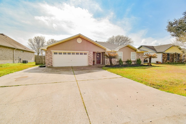 single story home with a garage and a front yard