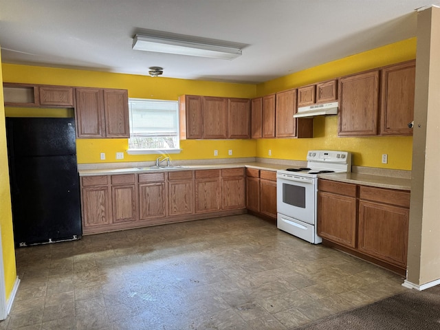 kitchen featuring black fridge, sink, and white electric range