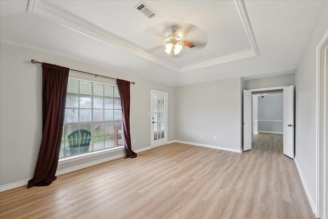 1120 Meadowvale Dr, Beaumont, TX 77706 - spare room featuring a raised ceiling, light wood-type flooring, a ceiling fan, and crown molding