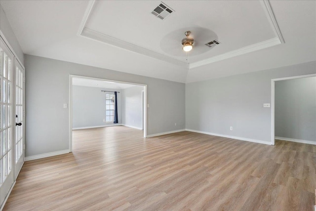 1120 Meadowvale Dr, Beaumont, TX 77706 - unfurnished room with a raised ceiling, ceiling fan, light wood finished floors, and crown molding