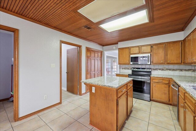 1120 Meadowvale Dr, Beaumont, TX 77706 - kitchen with stainless steel appliances, wood ceiling, crown molding, decorative backsplash, and brown cabinets