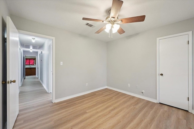 1120 Meadowvale Dr, Beaumont, TX 77706 - spare room with attic access, light wood-style flooring, and ceiling fan