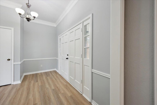 1120 Meadowvale Dr, Beaumont, TX 77706 - hall with a chandelier, light wood-style floors, and crown molding