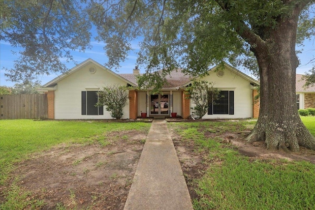 1120 Meadowvale Dr, Beaumont, TX 77706 - ranch-style house with a chimney and french doors