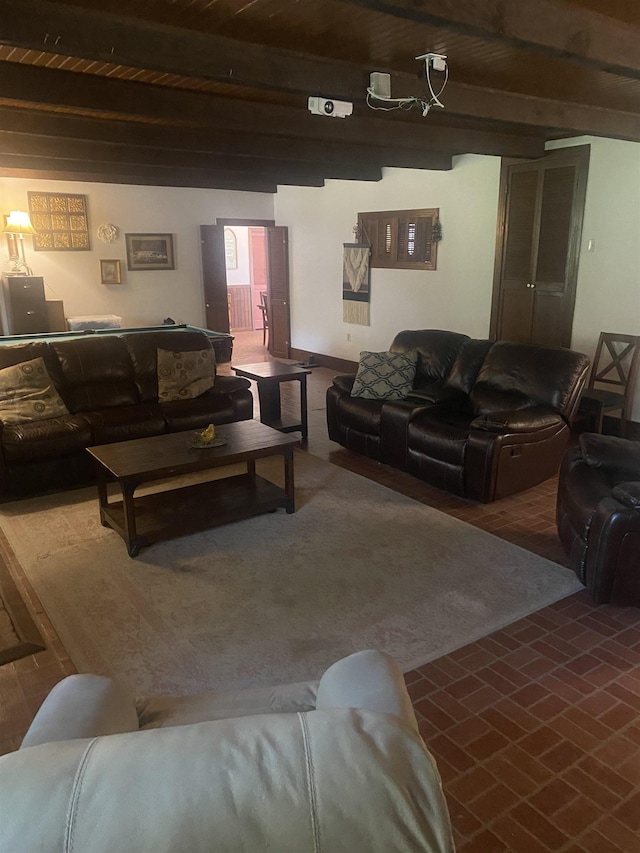 living room featuring beam ceiling and wood ceiling