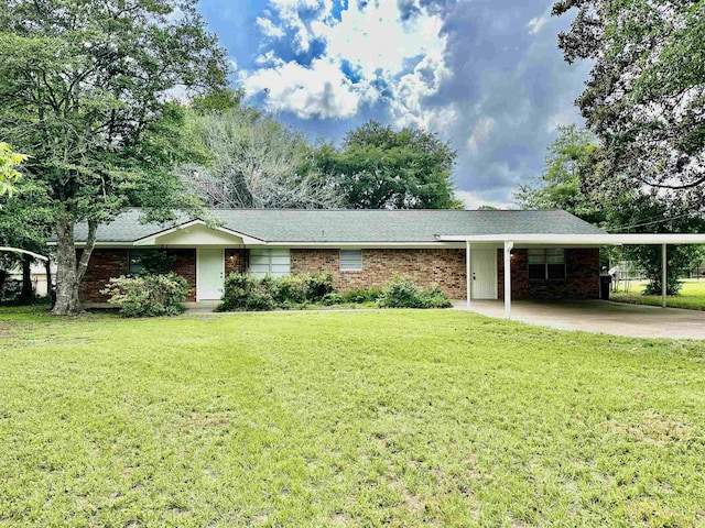 ranch-style home with a carport and a front lawn