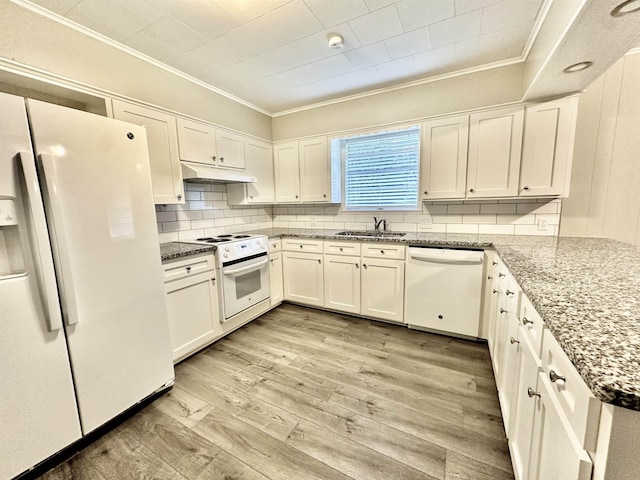 kitchen with tasteful backsplash, light stone counters, white appliances, white cabinets, and light wood-type flooring