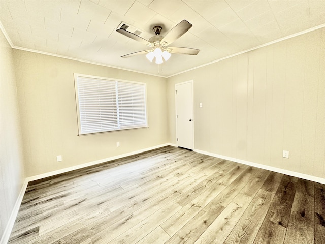 empty room featuring light hardwood / wood-style flooring, ceiling fan, and ornamental molding