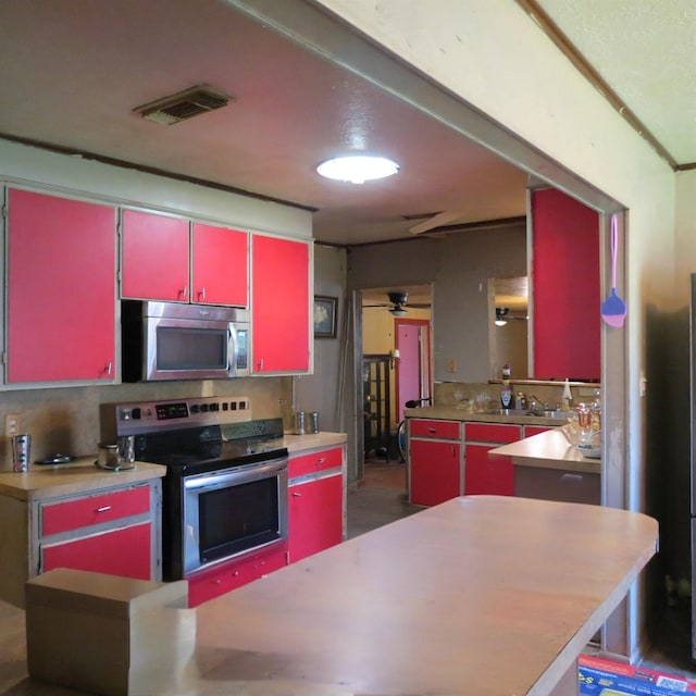 kitchen featuring ceiling fan and appliances with stainless steel finishes