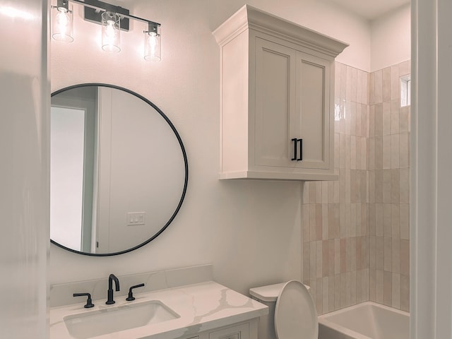 full bathroom featuring shower / bathing tub combination, vanity, and toilet