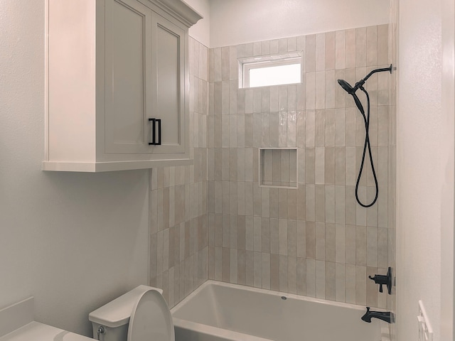 bathroom featuring bathtub / shower combination and toilet