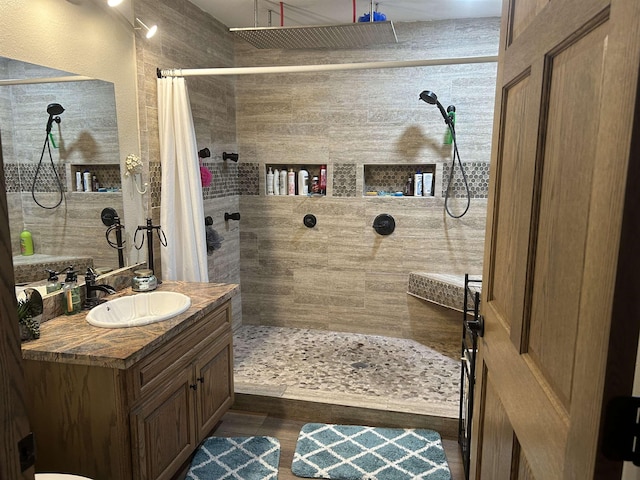 bathroom with vanity and walk in shower