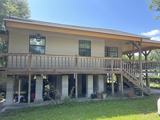 rear view of house featuring a deck