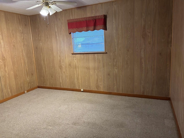 1001 Macarthur Dr, Port Neches, TX 77651 - unfurnished room with carpet floors, ceiling fan, and wooden walls