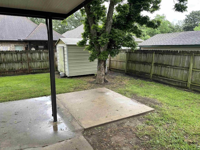 1001 Macarthur Dr, Port Neches, TX 77651 - view of yard with a patio, a fenced backyard, a storage shed, and an outdoor structure