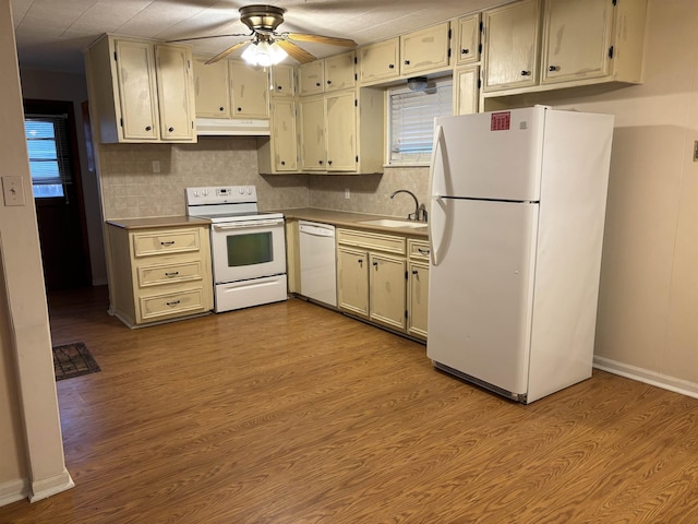 1001 Macarthur Dr, Port Neches, TX 77651 - kitchen with a ceiling fan, tasteful backsplash, a sink, under cabinet range hood, and white appliances