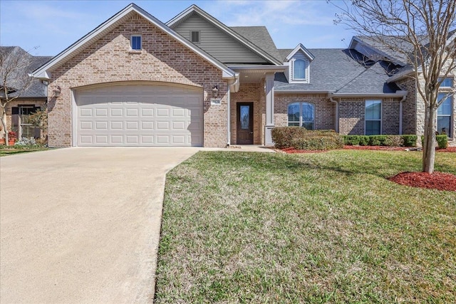 view of front facade featuring a front yard, driveway, roof with shingles, a garage, and brick siding