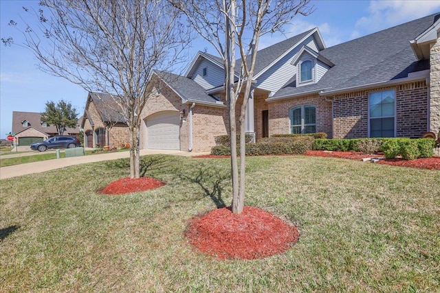 view of front facade featuring brick siding, driveway, an attached garage, and a front lawn