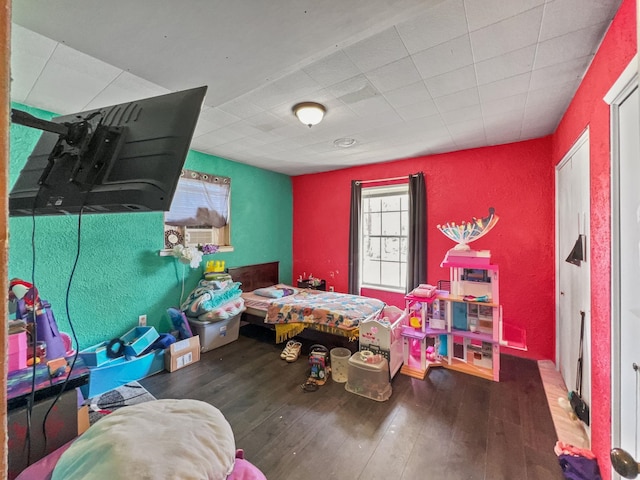bedroom with hardwood / wood-style floors