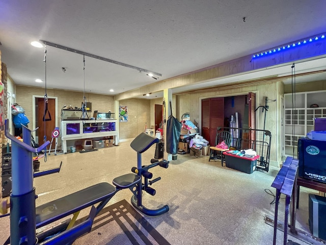 exercise area with a textured ceiling