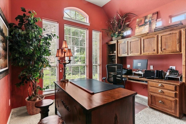 3495 Briar Way, Beaumont, TX 77706 - home office with carpet flooring, healthy amount of natural light, built in desk, and lofted ceiling
