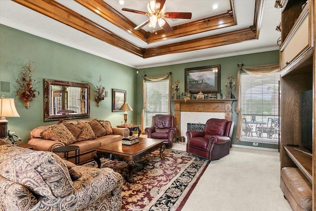 3495 Briar Way, Beaumont, TX 77706 - carpeted living area with a raised ceiling, plenty of natural light, ceiling fan, crown molding, and a fireplace