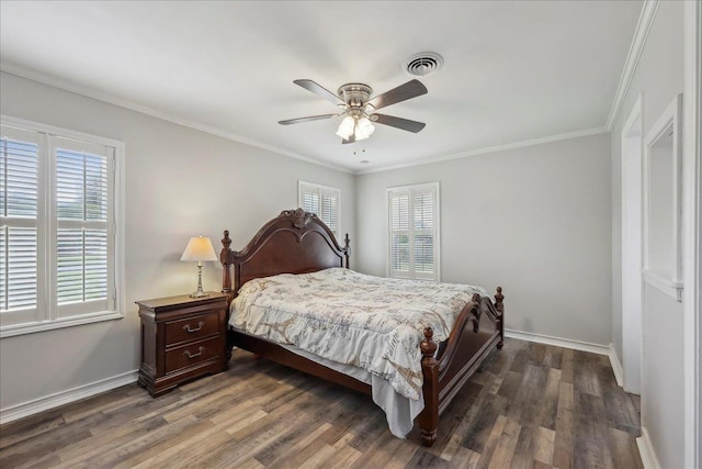5520 N Circuit Dr, Beaumont, TX 77706 - bedroom featuring dark wood-style floors, baseboards, ornamental molding, and visible vents