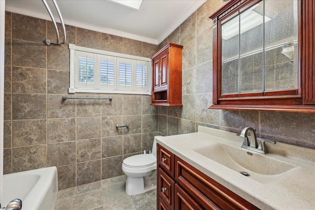 5520 N Circuit Dr, Beaumont, TX 77706 - full bathroom with vanity, toilet, a tub, and tile walls