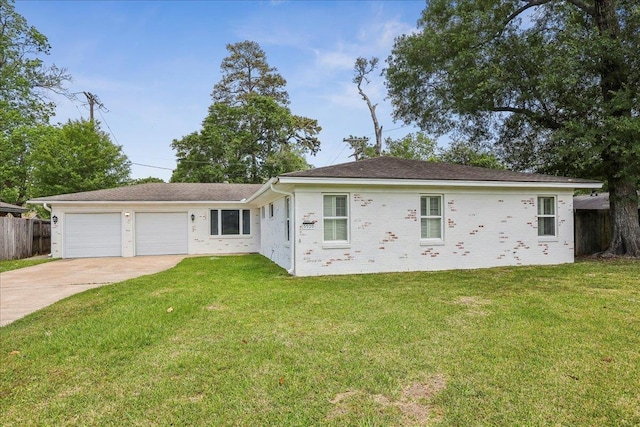 5520 N Circuit Dr, Beaumont, TX 77706 - single story home featuring an attached garage, driveway, a front lawn, and fence