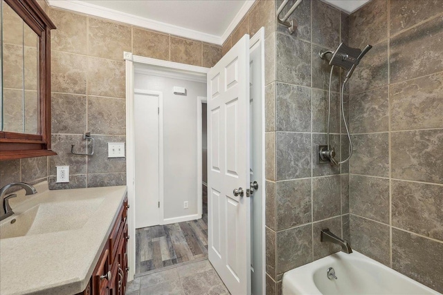 5520 N Circuit Dr, Beaumont, TX 77706 - bathroom featuring crown molding, vanity,  shower combination, and tile walls