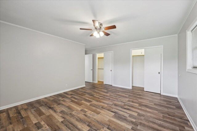 5520 N Circuit Dr, Beaumont, TX 77706 - unfurnished bedroom with baseboards, dark wood-type flooring, and ornamental molding
