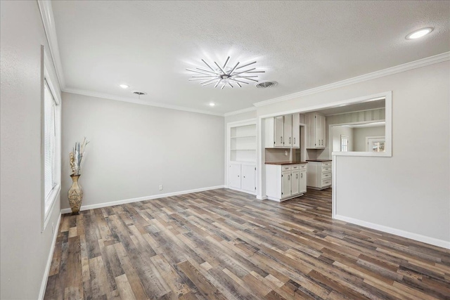 5520 N Circuit Dr, Beaumont, TX 77706 - unfurnished living room featuring visible vents, crown molding, baseboards, a textured ceiling, and dark wood-style flooring