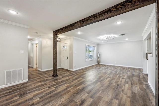 5520 N Circuit Dr, Beaumont, TX 77706 - below grade area featuring visible vents, dark wood-style floors, and ornamental molding