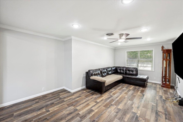 5520 N Circuit Dr, Beaumont, TX 77706 - living area featuring baseboards, visible vents, wood finished floors, ceiling fan, and crown molding